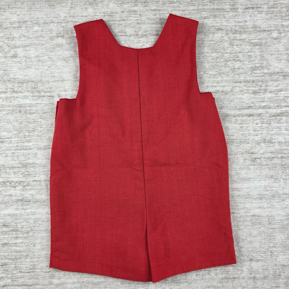 Angled welt pocket and side button detail
