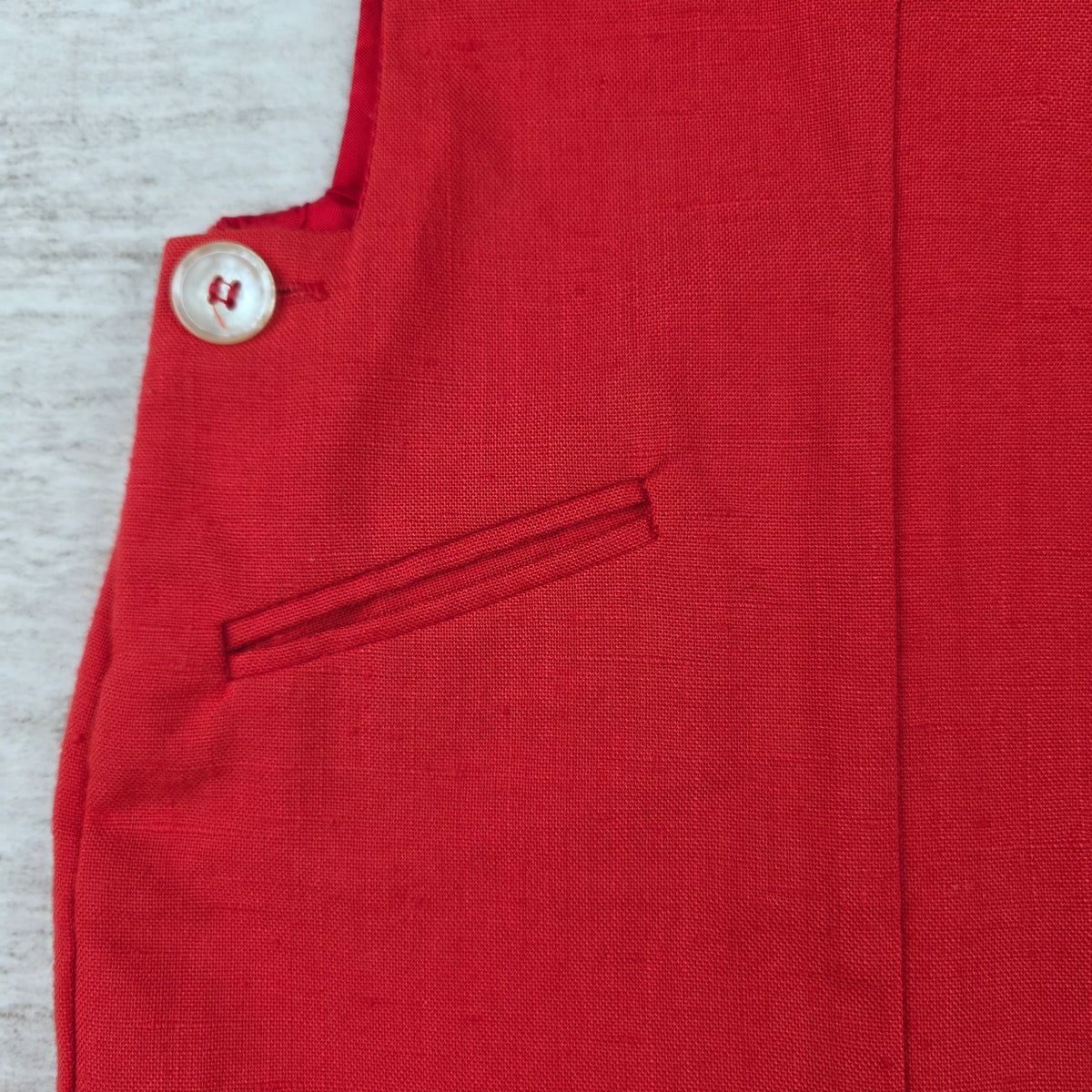 Back of red shortall romper