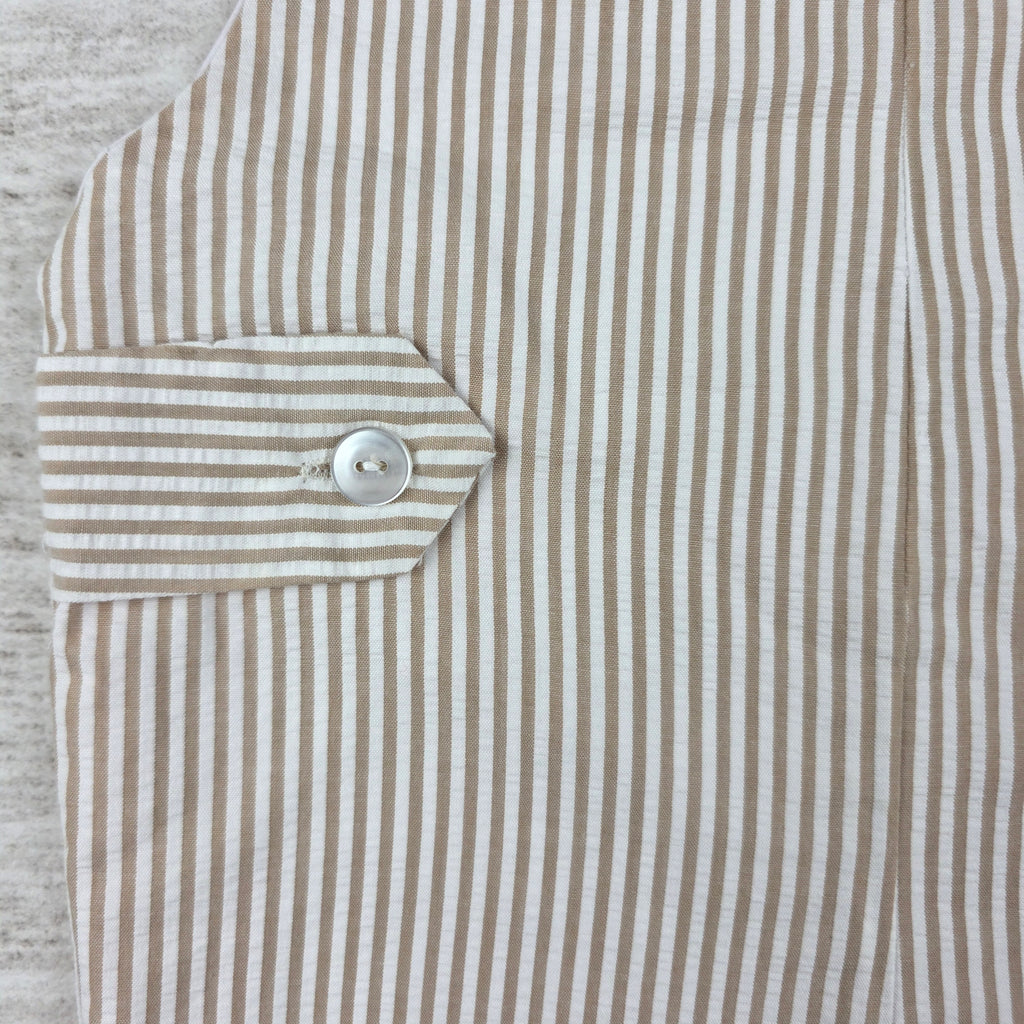 Back tab button and striped fabric detail