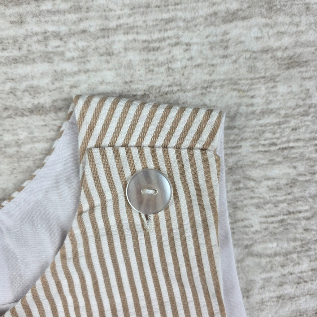 Front of tan and white striped cowboy appliqué shortall