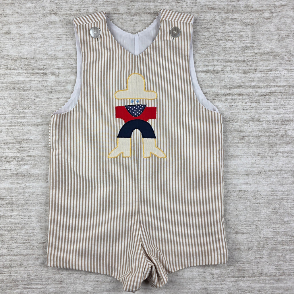 Faded garment label inside shortall